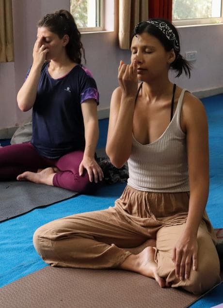 Women doing yoga/PEXELS